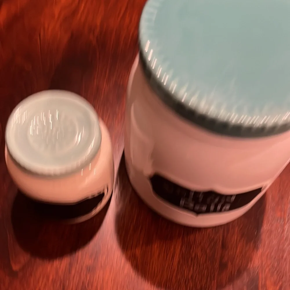 Two ceramic containers with covers and chalkboard labels